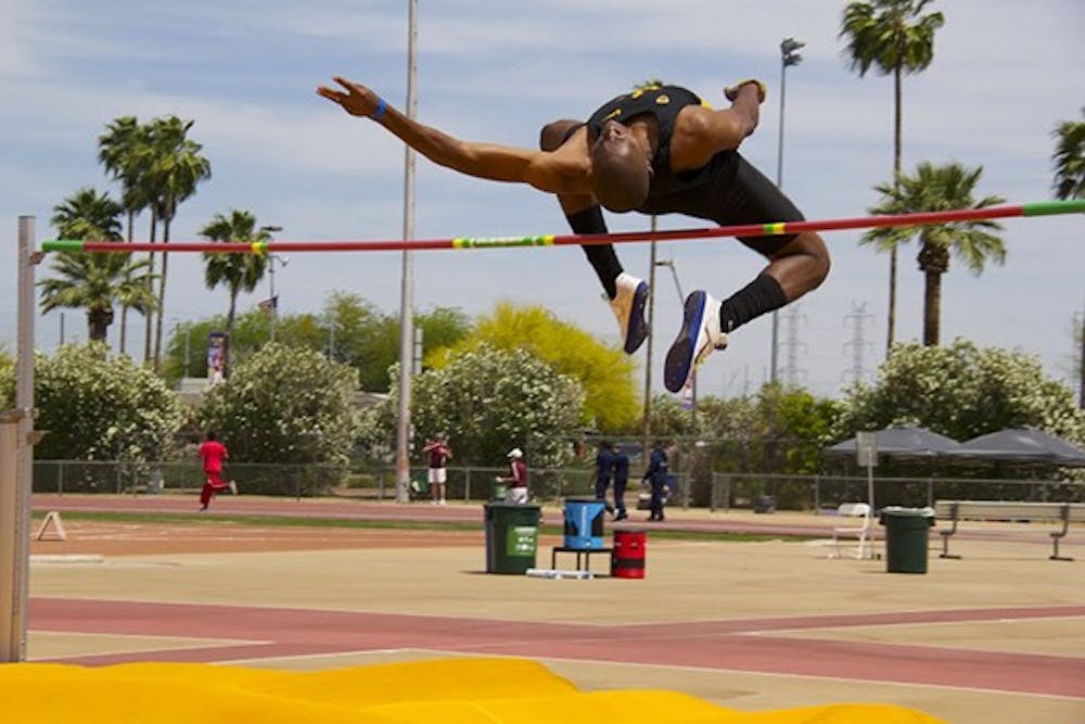Then-junior high-jumper Edmond Baker clears the bar during the Sun Angel Track Classic at Sun Angel Stadium on Saturday, April 12, 2014. ASU travels to Albuquerque for the New Mexico Invitational this weekend. (Photo by Becca Smouse)