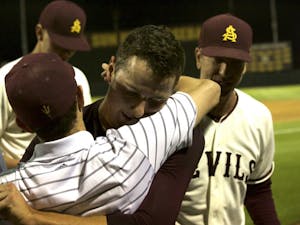 Ryan Hingst celebrates with team members after pitching a no hitter against the University of Utah at Phoenix Municipal Stadium on Friday, March 25, 2016. ASU baseball won 5-0.