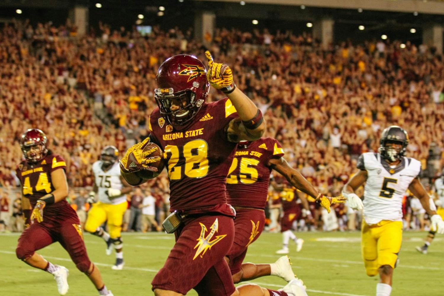 Defensive back, Viliami "Laiu" Moeakiola (28), picks pass and runs for a touchdown during the football game versus the California Golden Bears in Tempe, Arizona, on Saturday, Sept. 24, 2016.