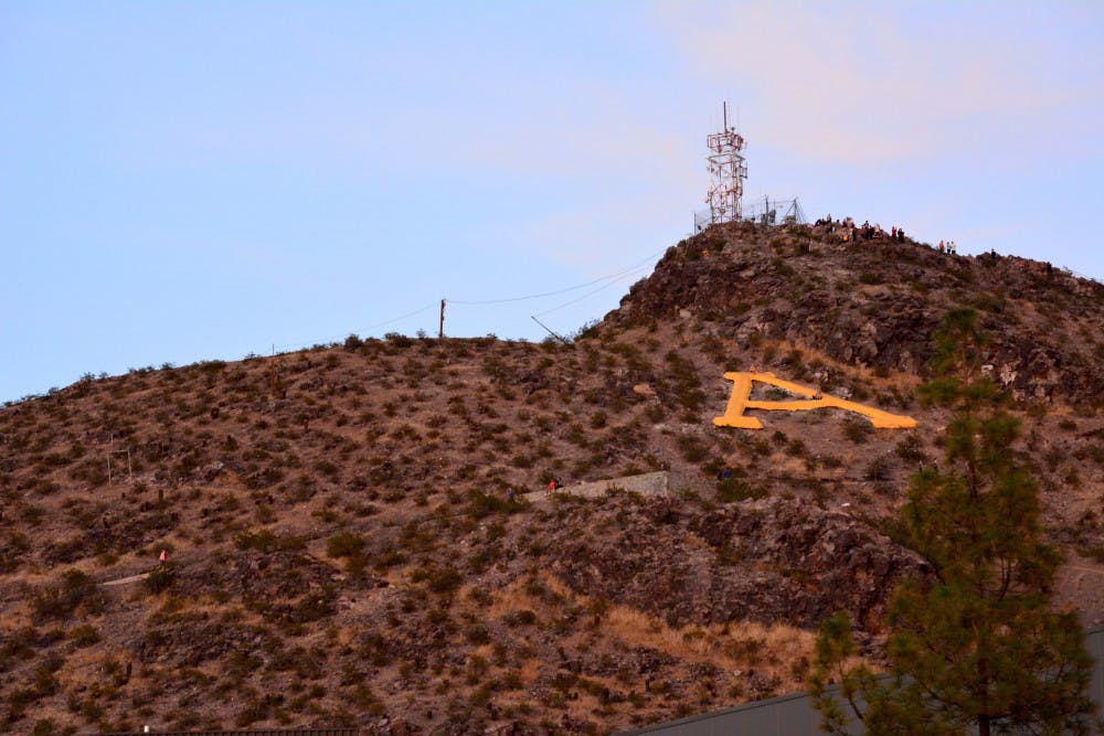 Hayden Butte Mountain sporting the iconic ASU “A” as seen on Jan. 18 in Tempe. Due to the paint war between ASU and rival UA, historic petroglyphs on the mountain have been damaged. (Krista Tillman/ The State Press).