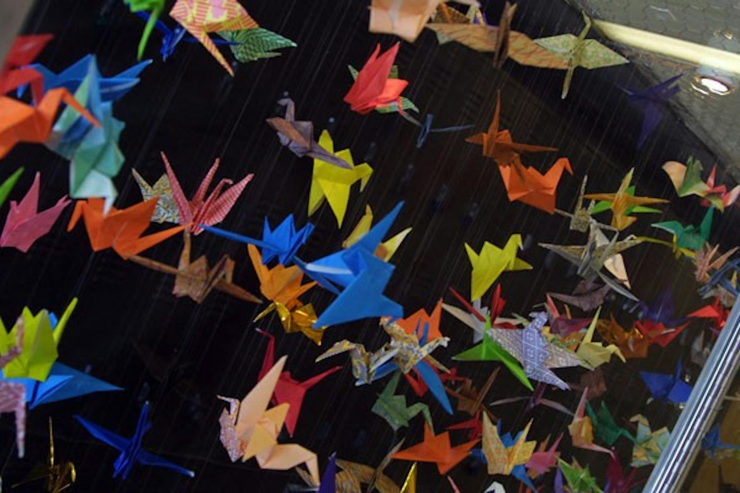 WISHFUL THINKING: Hundreds of paper cranes hang in a display inside the Art building. Each crane encompasses a wish made by the students who folded them. (Photo by Serwaa Adu-Tutu)