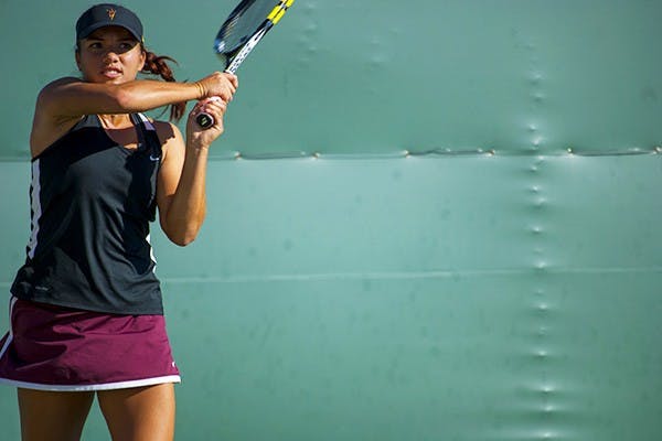 Sophomore Desirae Krawzcyk swings at the ball at the Invitational. Desirae (Photo by Murphy Bannerman)