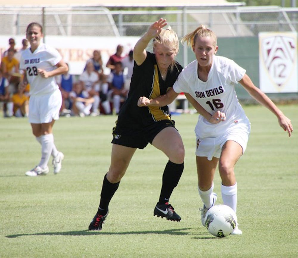 GETTING PHYSICAL: ASU sophomore midfielder Blair Alderson fends off a Missouri player during the Sun Devils’ 1-0 loss against the Tigers on Sunday. ASU went 1-1 in their annual Sun Devil Classic over the weekend. (Photo by Rosie Gochnour)