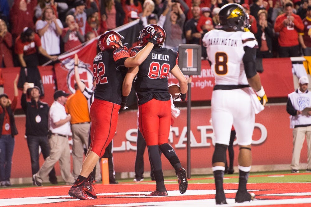 Utah junior tight end Ken Hampel (82) celebrates with sophomore tight end Harrison Handley (88) after Handley scored a touchdown against ASU on Saturday, Oct. 17, 2015, at Rice-Eccles Stadium in Salt Lake City, Utah.