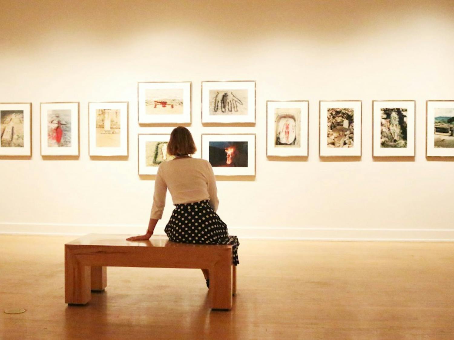 Heather Lineberry, Senior Curator and Associate Director at the ASU Art Museum, sits infront of Ana Mendieta’s Siluetas series at the ASU Art Mueseum in Tempe. This art series is Mendietas most famous work and it focuses on what she calls earth-body sculutres. 