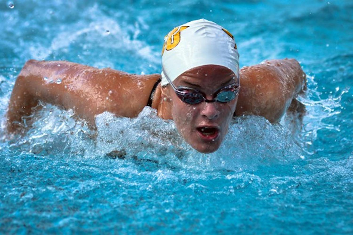 BREAKTHROUGH: ASU junior Caroline Kuczynski breaks through the water in her butterfly race during the Sun Devils’ home meet against Wisconsin on Saturday. Kuczynski won four events to help the ASU women’s team beat the Badgers 174-104. (Photo by Aaron Lavinsky)