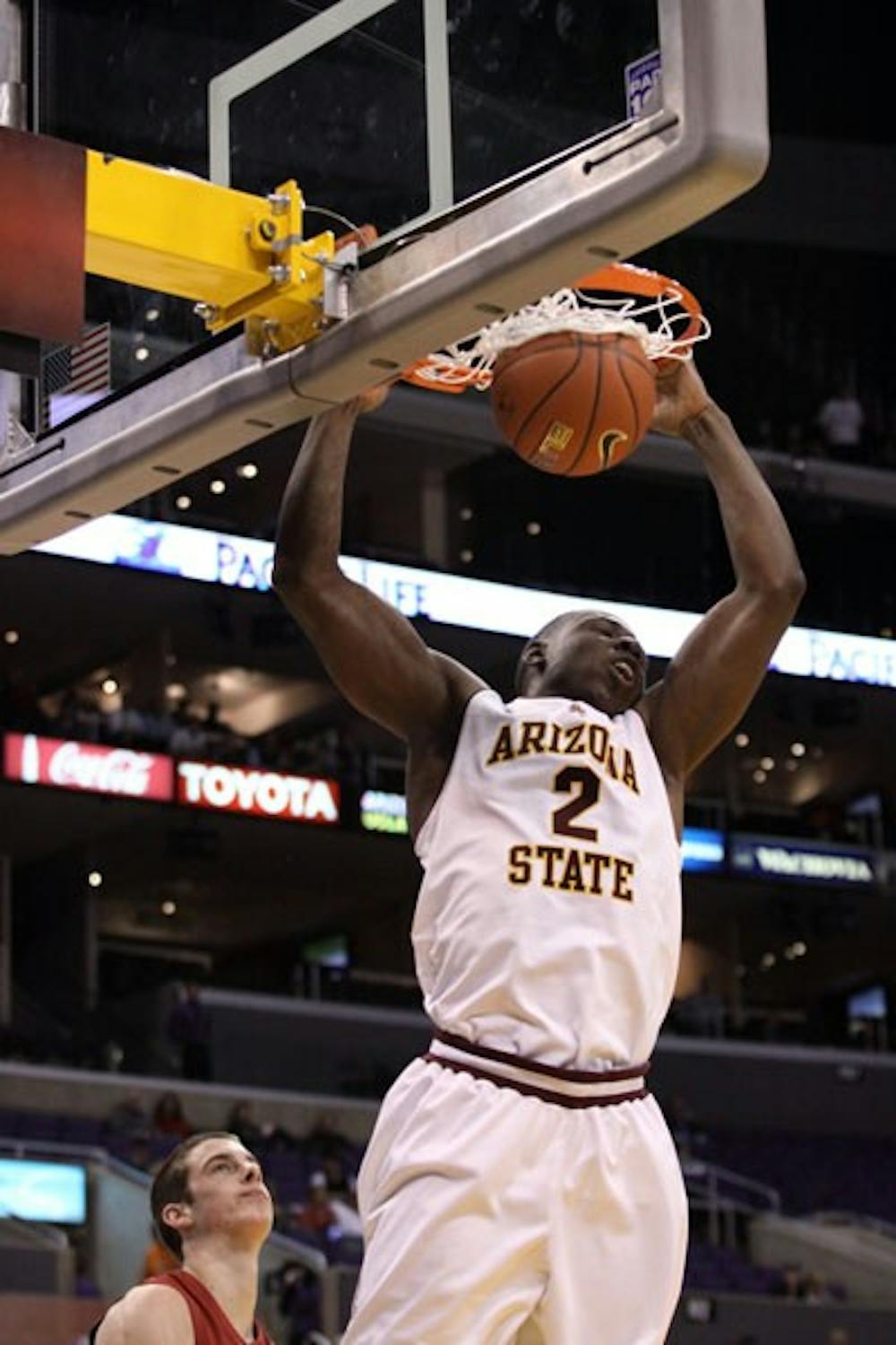 NOT ENOUGH: Senior center Eric Boateng slams home a dunk during ASU's 70-61 loss to Stanford in the Pac-10 Quarterfinals on Thursday at Staples Center in Los Angeles. ASU's NCAA Tournament hopes took a hit with the loss. (Photo Courtesy of Steve Rodriguez)