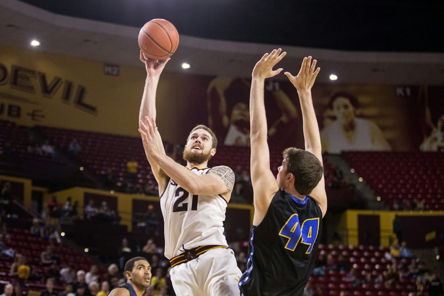 Arizona State Sun Devils forward Eric Jacobsen, left, takes a shot over UCSB forward Sam Beeler during a game against UC Santa Barbara at Wells Fargo Arena in Tempe, Ariz., on Sunday, Nov. 29, 2015. The ASU Sun Devils took down the UC Santa Barbara Gauchos, 70-68.