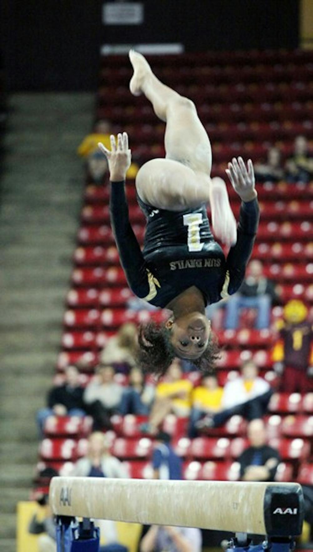 Beaté Jones performs a flip on the balance beam in a meet against UA on Jan. 27. Jones and the Sun Devils look to maintain their success as they head into the second half of the season. (Photo by Beth Easterbrook)