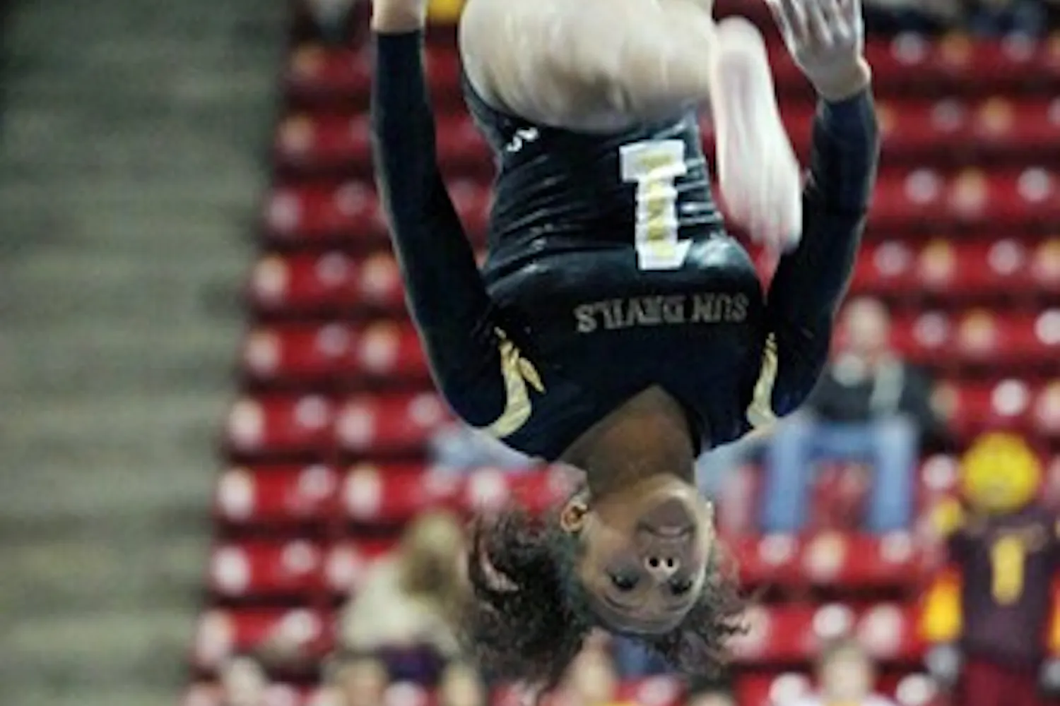 Beaté Jones performs a flip on the balance beam in a meet against UA on Jan. 27. Jones and the Sun Devils look to maintain their success as they head into the second half of the season. (Photo by Beth Easterbrook)