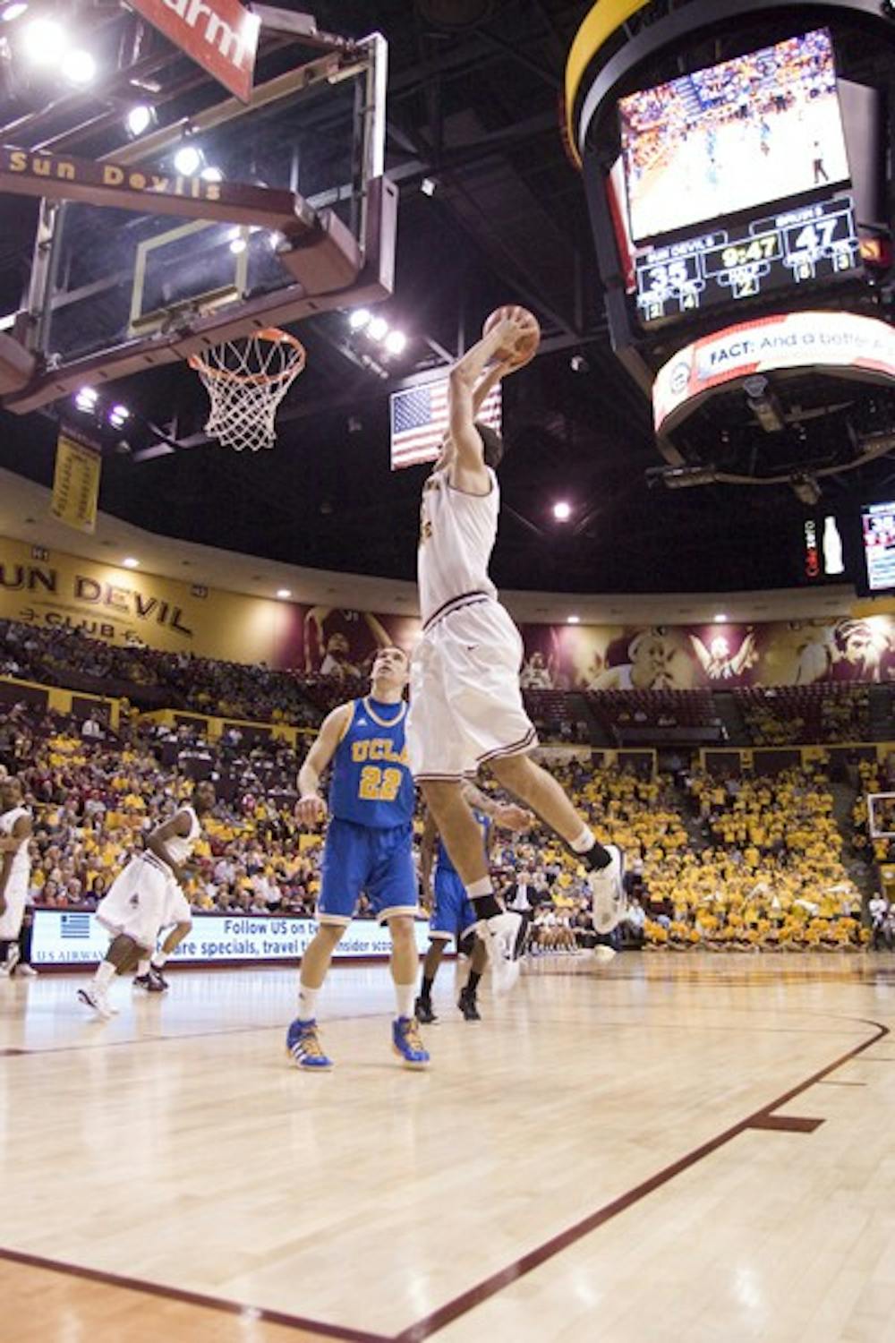 Big Air: ASU freshman center Jordan Bachynski goes up for a dunk during the Sun Devils’ 73-72 overtime loss against UCLA on Saturday. It appears that the Sun Devils have finally gotten rid of the injury bug. (Photo by Scott Stuk)