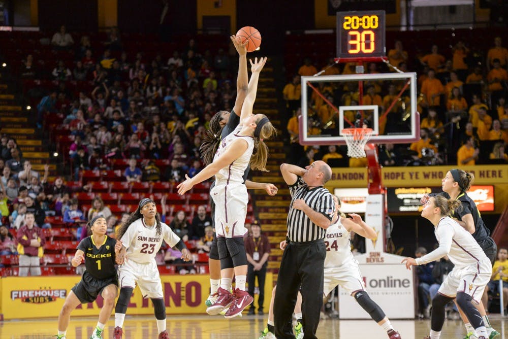 The tip-off between ASU and Oregon in Friday’s “Kids to College Field Trip” game on Jan. 23, 2015, at Wells Fargo Arena in Tempe. (J. Bauer-Leffler/The State Press)