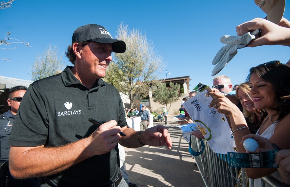 Phil Mickelson signs autographs for fans at the Waste Management Phoenix Open on Saturday, Feb. 6, 2016, at TPC Scottsdale.