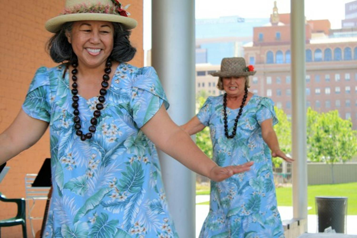 Tropical Breeze, a Hawaiian musical and dance group, performed in downtown Phoenix Tuesday afternoon as part of the Civic Space Lunchtime Concert Series, which includes free live music and food trucks. (Photo by Jessie Wardarski)
