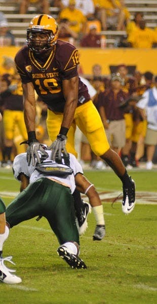 LIFT OFF: Junior linebacker Oliver Aaron leaps over a Portland State offensive lineman earlier this season. After playing well against Wisconsin, Aaron will start this week against Oregon. (Photo by Aaron Lavinsky)
