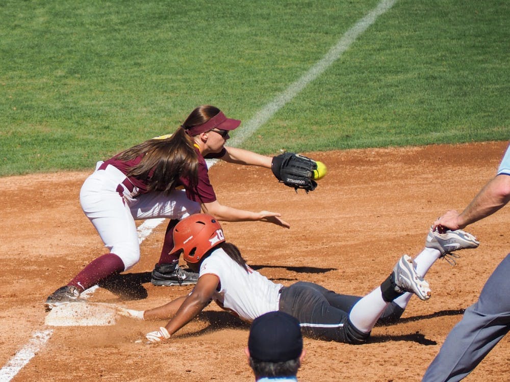Senior third baseman Haley Steele tries to tag Texas Longhorn Lindsey Stephens near third base on February 8, 2015 at Farrington Stadium in Tempe. ASU lost 9-4 (J. Bauer-Leffler/The State Press)