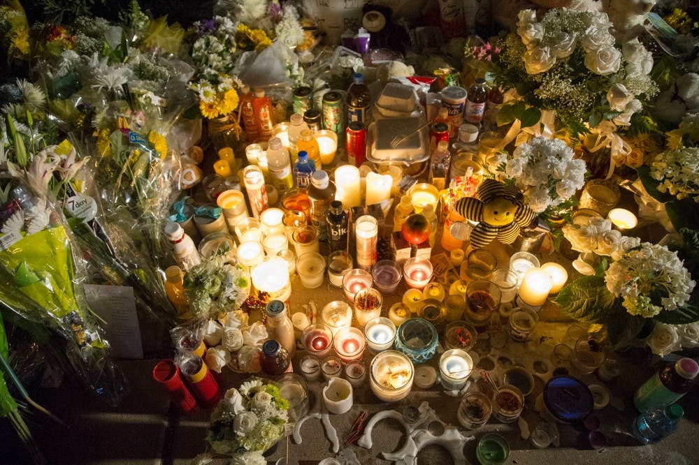 Candles, flowers, stuffed animals and assorted favorite foods of ASU Student&nbsp;Yue Jiang&nbsp;are seen on Tuesday, Jan. 19, 2016,&nbsp;in Tempe&nbsp;at the impromptu memorial set up by friends, fellow students and Tempe's Chinese-American community just East of the Broadway and McClintock intersection where a case of road rage is blamed for the young woman's death.