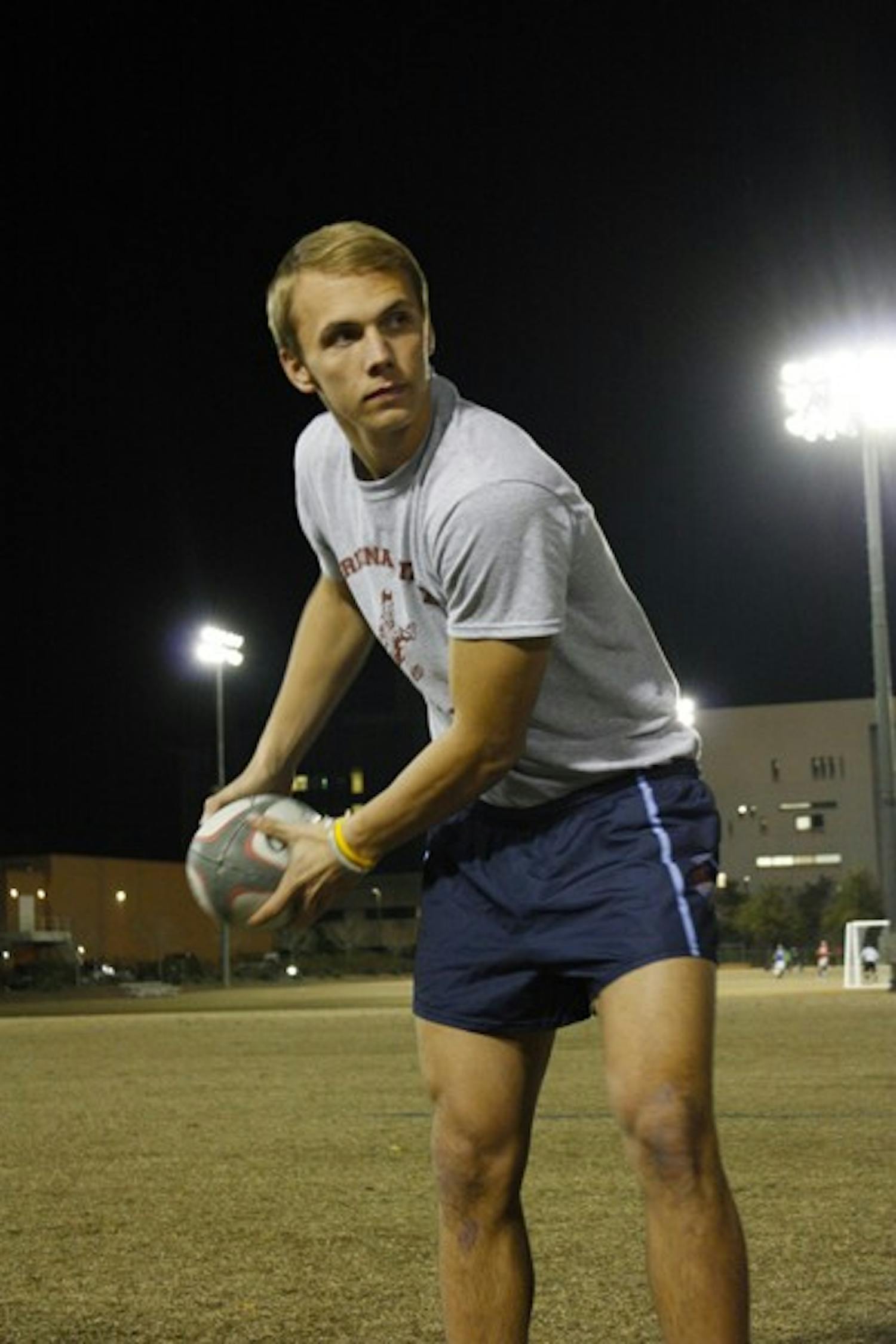 Adam Sandstrom passes the ball before practice Wednesday night. Sandstrom is on a path to international success, playing on both the ASU men’s and USA Rugby men’s national U-20 teams. (Photo by Cameron Tattle)