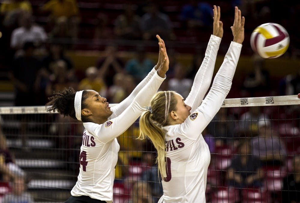 Lexi MacLean, left, and Kizzy Ricedorff attempt to block an incoming shot during ASU's game against NAU on Tuesday, Sept. 8, 2015 at Wells Fargo Arena in Tempe. The Sun Devil volleyball squad beat the visiting Northern Arizona University Lumberjacks 3-1 (25-17, 13-25, 25-13, 25-20), improving to a perfect 7-0 overall record. 