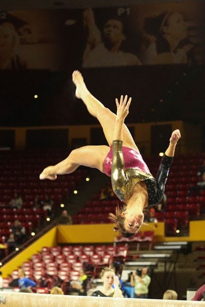 Junior Morgan Steigerwalt performs her beam routine during the first home meet. (Photo courtesy of Arianna Grainey)
