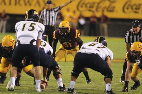 Senior linebacker Brandon Magee carries the ball downfield for a touchdown after intercepting a pass during the Sun Devils’ 63-6 win over NAU last Thursday. (Photo by Sam Rosenbaum)