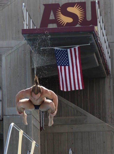 Senior diver Harrison Jones tucks his head for a flip during a meet against Stanford on Jan. 25 at the Mona Plummer Aquatics Complex. (Photo by Dominic Valente)