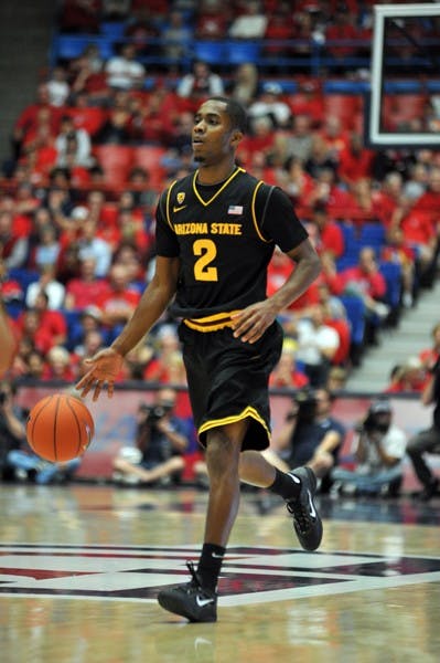 Chris Colvin dribbles up the court in a game against UA on Dec. 31, 2011. Colvin was one of three players suspended for the last meeting between ASU and UCLA. (Photo by Aaron Lavinsky)