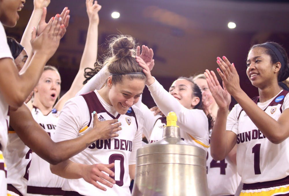 Redshirt senior Katie Hempen (0) celebrates after ringing the victory bell in the Wells Fargo Arena on Friday, March 18, 2016, in Tempe, Arizona. The Sun Devils defeated New Mexico State 74-52 and will move on to the second round of the NCAA Women's Basketball tournament.