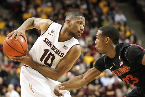 Junior guard Evan Gordon pulls the ball back to protect it from a Stanford defender on Feb. 9. Gordon and the rest the ASU basketball team are focused on the upcoming games that have tournament implications. (Photo by Sam Rosenbaum)