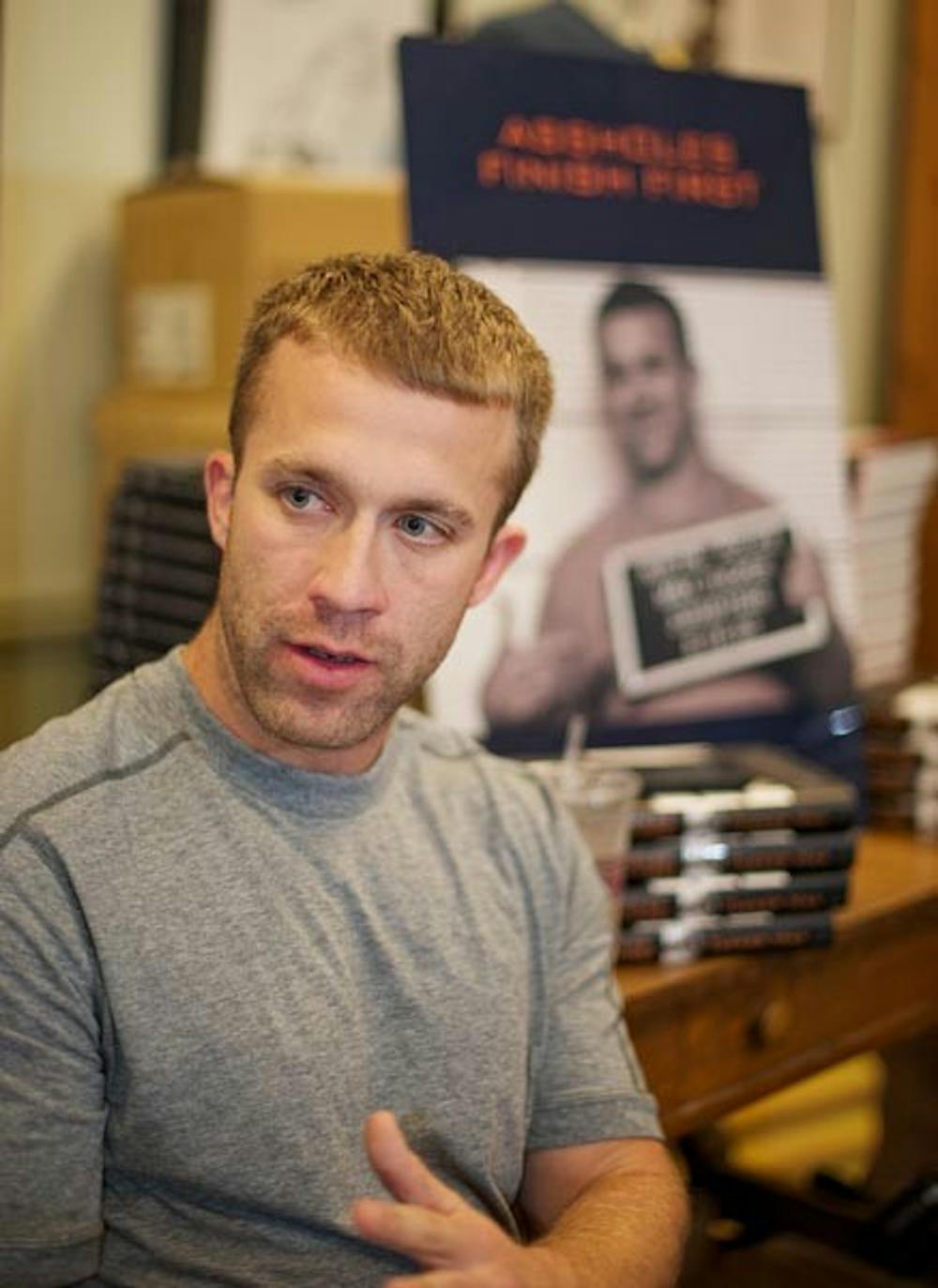 FINISHING FIRST: Best-selling author and law school graduate Tucker Max of "I Hope They Serve Beer in Hell" answers questions posted by the ASU Law School Club prior to his book signing at Changing Hands Bookstore. Max's new book, "Assholes Finish First," comes after the success of his first book, which the author wrote and produced as a movie. (Photo by Michael Arellano)