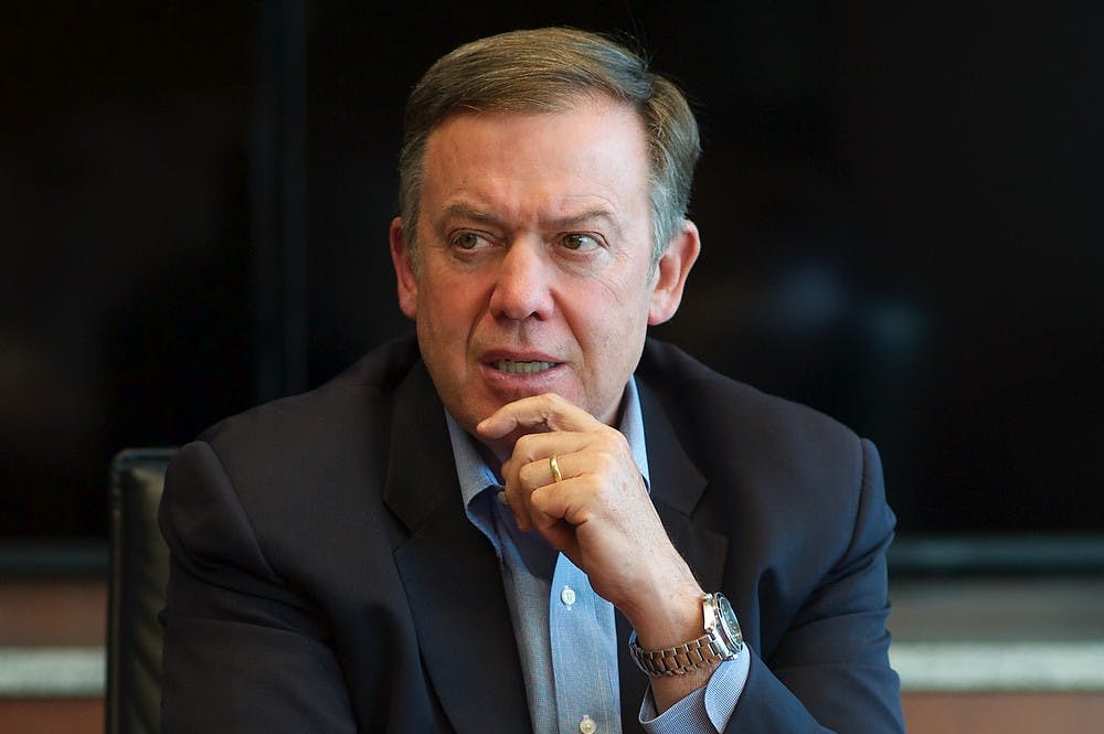 ASU President Michael Crow meets with The State Press editorial board on Friday, April 3, 2015 at the Fulton Center in Tempe. (Ben Moffat/The State Press)