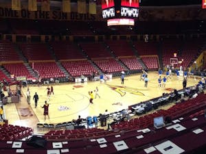 At Wells Fargo Arena in Tempe, Ariz., reporters sit in rows of press tables situated within the crowd above the visitors' bench. This view is seen as teams warm up prior to ASU men's basketball vs. Creighton University on Dec. 20, 2016.