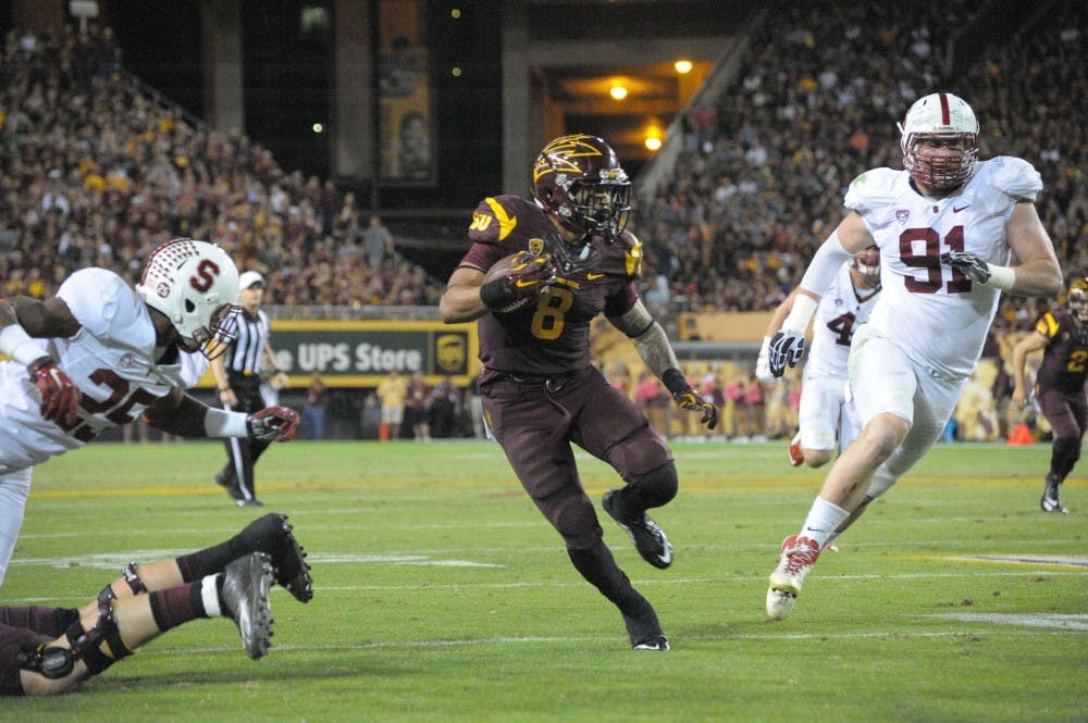 Junior tailback D.J. Foster carries the ball against Stanford, Saturday, Oct. 18, 2014 at Sun Devil Stadium in Tempe. The Sun Devils beat the Cardinal, 26-10.