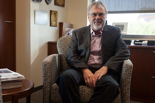 Provost Robert E. Page Jr. poses in his office. Page collaborated with an international team have answered what genetic differences there are between male and female bees, and this gives insight into human genetic mysteries, such as Alzheimer's. (Photo by Ryan Liu)
