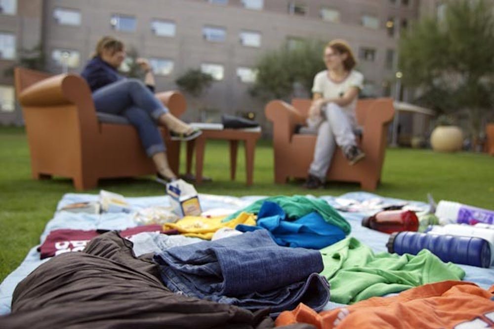 GREENER LIVING: ASU's first No Impact Week kicked off on Sunday when the 110 students signed up to take part in the week were asked to refrain from buying anything new. No Impact Week is an initiative that encourages students on the Tempe campus to live greener. (Photo by Scott Stuk)