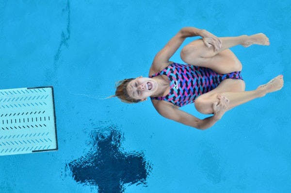 Now-senior diver Hailey Casper descends into the water during an ASU dive practice. (Photo by Aaron Lavinsky)