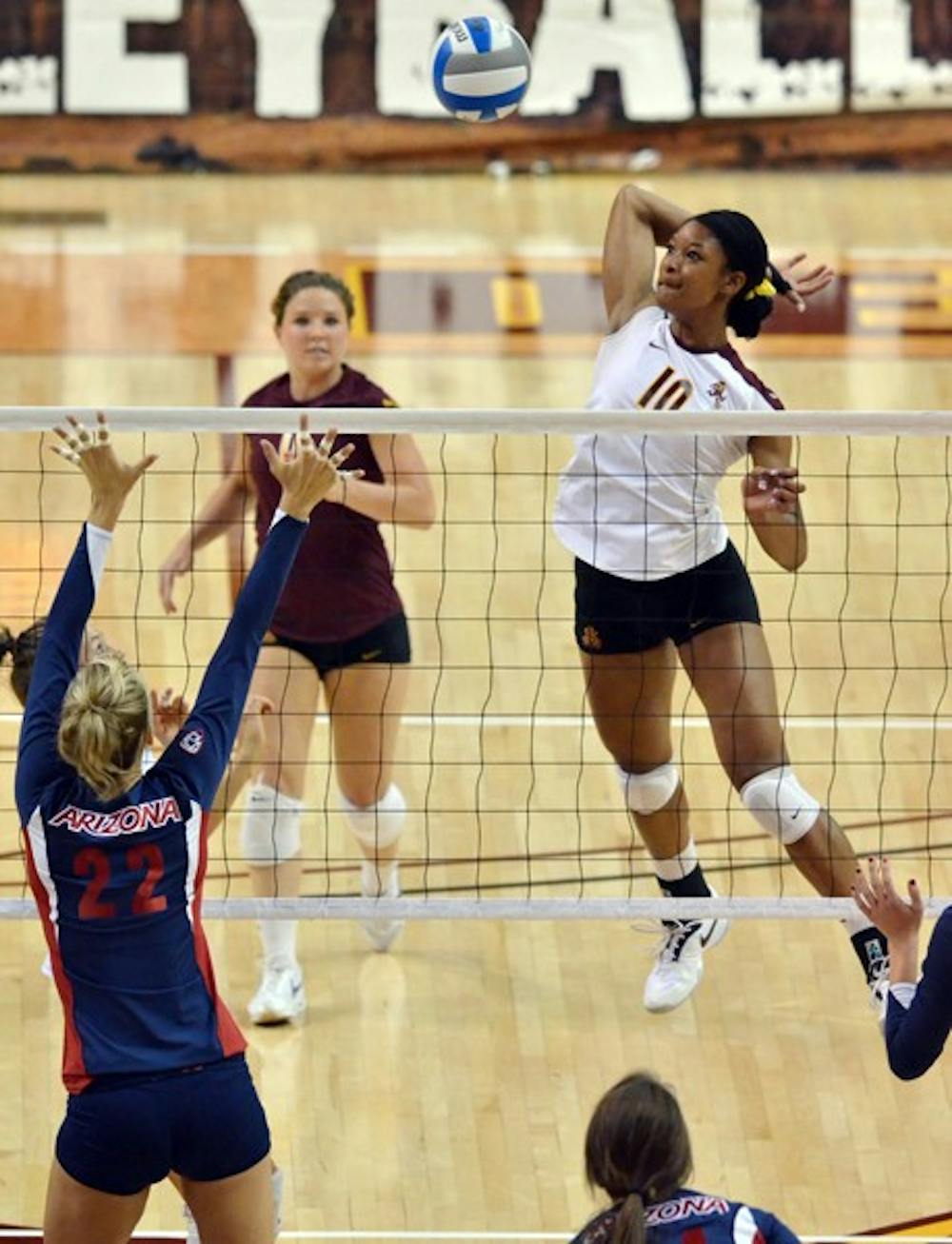 TOUGH START: ASU junior middle blocker Erica Wilson spikes the ball during a match against UA last season. The Sun Devils opened up Pac-12 play with a pair of loss against Oregon and Oregon State over the weekend. (Photo by Aaron Lavinsky)