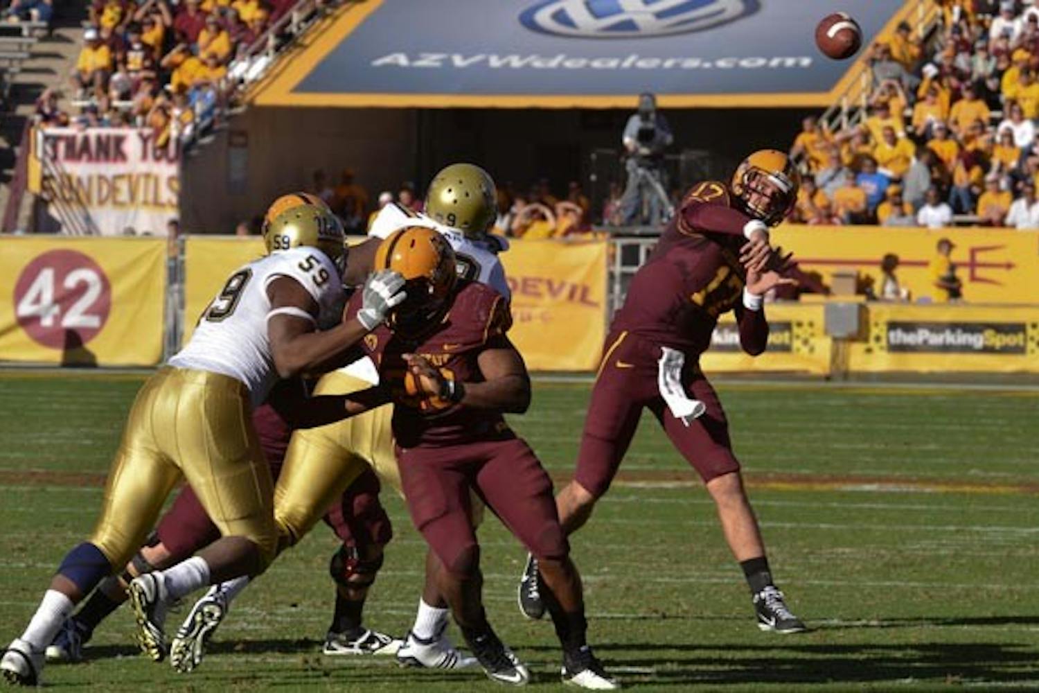 BROCK SOLID: Sophomore quarterback Brock Osweiler fires a pass during Saturday's game against UCLA. In the 55-34 ASU win, Osweiler passed for 380 yards and four touchdowns while completing 27 of 36 passes in what was the best statistical performance by an ASU quarterback since Dennis Erickson took over as coach. (Photo by Aaron Lavinsky)