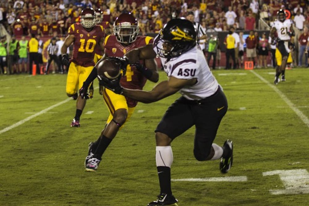 Sophomore wide receiver Cameron Smith catches a ball in a game against USC on Oct. 4, 2014. ASU won against USC 38-34. (Photo by Alexis Macklin)