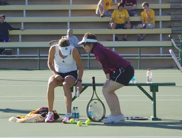 Tough Schedule: ASU coach Sheila McInerney talks to Jacqueline Cako in between sets against Iowa State on Jan. 21 in Tempe. Like many sports in the Pac-10, the Sun Devils are forced to play several high-ranked opponents during conference play, including four straight against teams in the top 15. (Photo by Nathan Meachem)