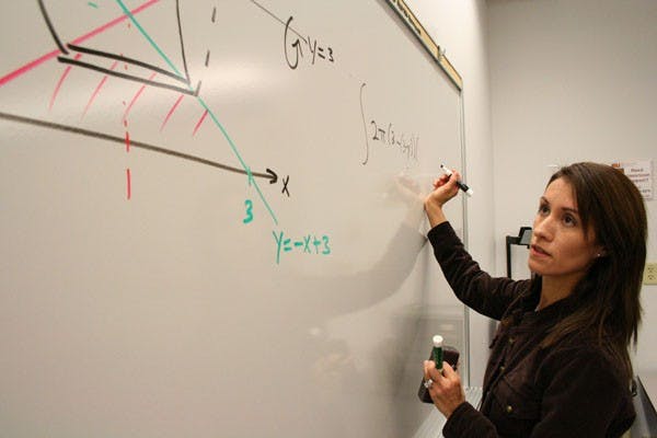 ROLE MODEL: Erika Camacho, who is an assistant mathematics professor on the West campus, was a student of Jaime Escalante. Jaime Escalante was a high school algebra teacher at James A. Garfield High School is Los Angeles, and was the inspiration for the movie "Stand and Deliver". (Photo by Kyle Thompson)