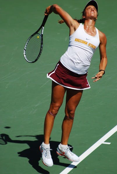 Senior Jacqueline Cako serves the ball during the Sun Devils' 5-2 loss to UCLA on April 6. Despite coming up empty in the Pac-12 championships over the weekend, Cako was named the Pac-12 Scholar Athlete of the Year at the tournament. (Photo by Murphy Bannerman)
