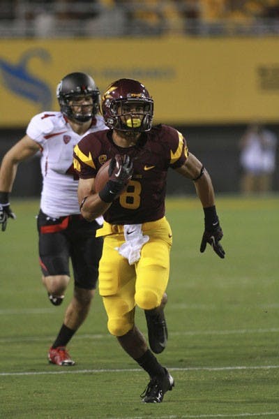 Freshman running back D.J. Foster runs past a Utah defender during the Sun Devils’ 37-7 win over the Utes last Saturday. (Photo by Sam Rosenbaum)