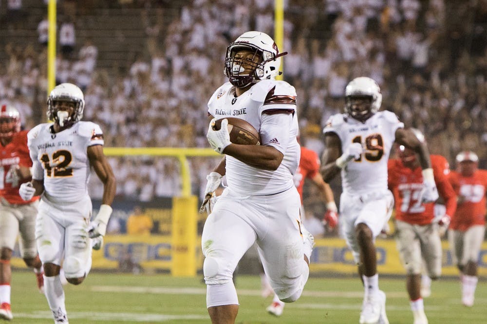 Sophomore running back Demario Richard carries a pass 93 yards for a touchdown against New Mexico on Friday, Sept. 18, 2015, at Sun Devil Stadium in Tempe, Arizona.