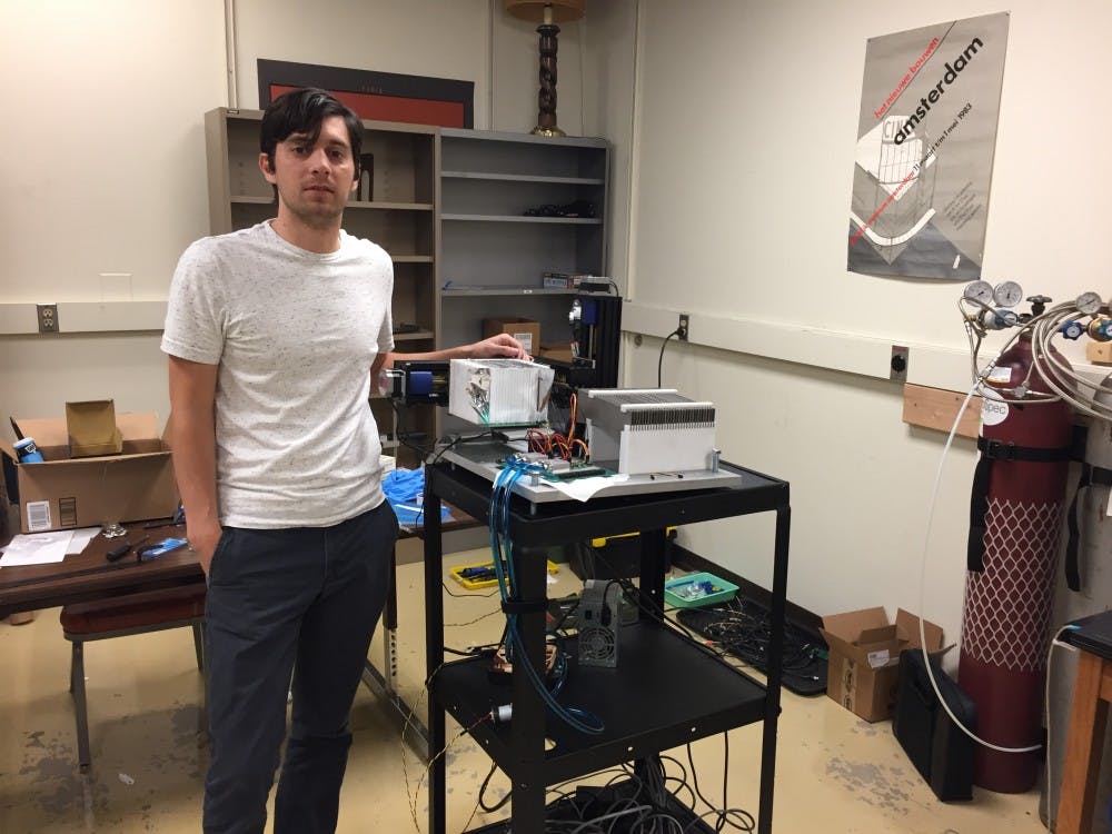 Jason Holmes poses for a photo with his prototype proton range detector in the H wing of the George M. Bateman Physical Science Center at ASU's Tempe campus&nbsp;on April 6, 2017.&nbsp;
