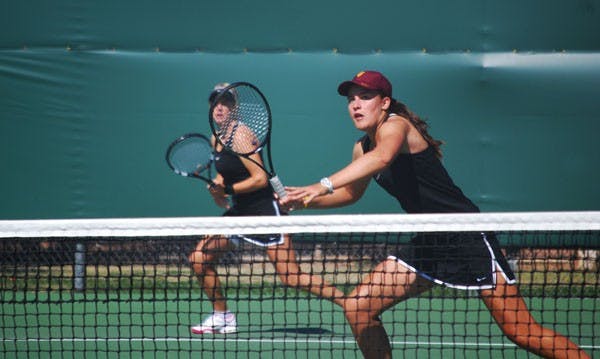 Freshman Ebony Panoho keenly watches her opponent's shot in a doubles game against Pepperdine on Feb. 23. Ebony is the only freshman with a losing record but has instrumental in many Sun Devil victories. (Photo by Murphy Bannerman)