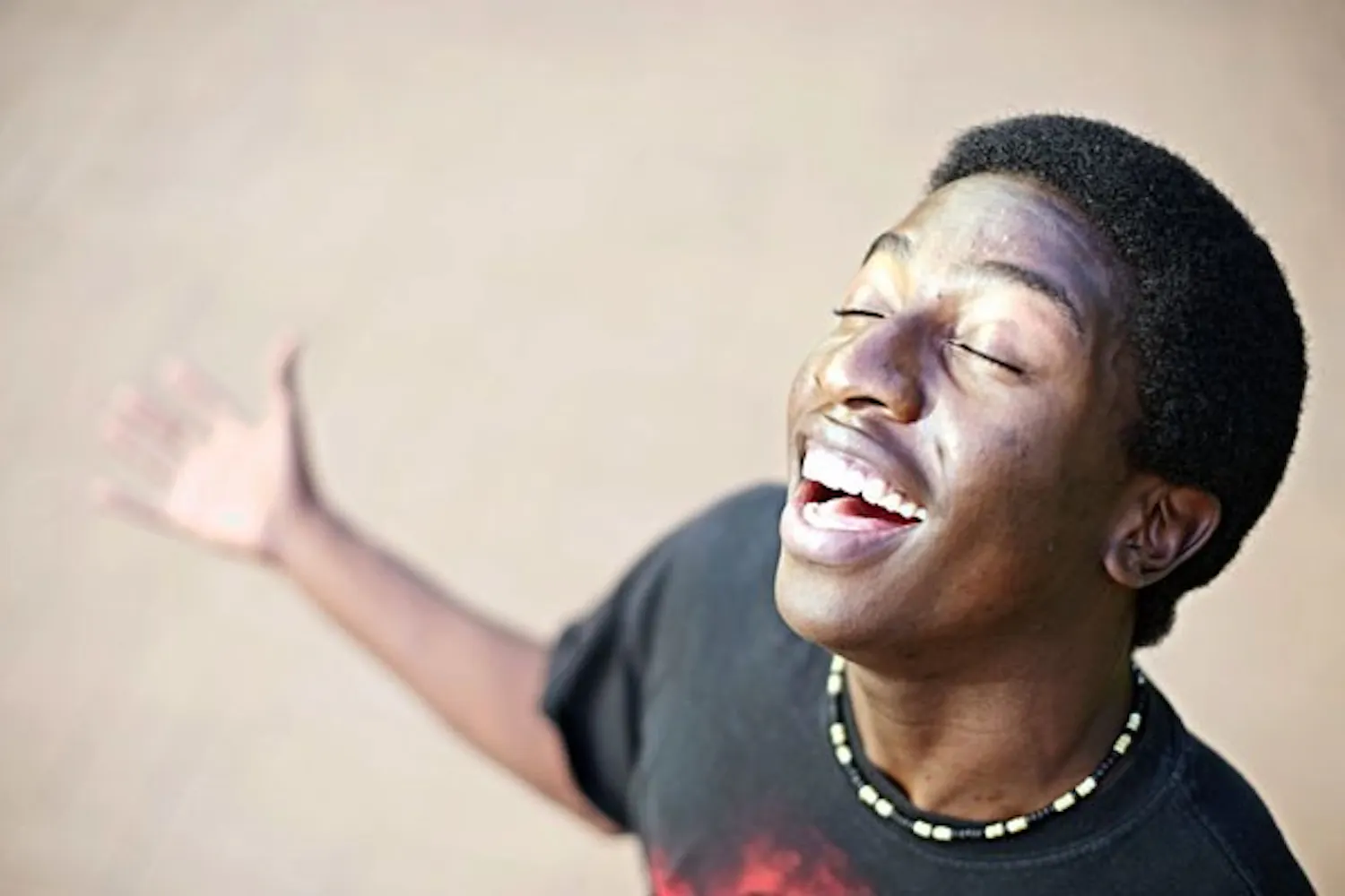 RISING STAR: Theater major Abraham Ntonya finds seclusion in the Barrett amphitheater to rehearse his a cappella singing, days after auditioning for the FOX show "Glee." Sophomore Ntonya, hopes his voice will land him one of the coveted 3 open spots on the TV series. (Photo by Michael Arellano)