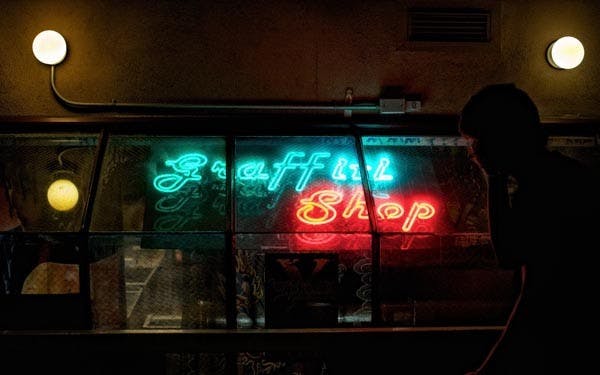 LONG-STANDING: The Graffiti Shop, located near Fifth Street and Mill Avenue, is one of the last original stores on the Mill Avenue Strip. (Photo by Michael Arellano)