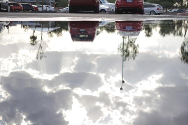 PUDDLE JUMPING: Heavy rain from Tuesday night's thunderstorms leave puddles around campus on Wednesday. (Photo by Andy Jeffreys)