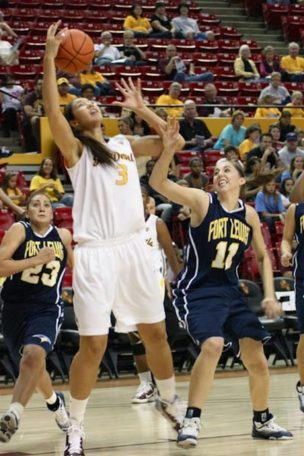 REBOUND HOUND: Sophomore forward/center Joy Burke pulls down a rebound against Fort Lewis in an exhibition game earlier this season. The ASU women's basketball team has put an increased focus on rebounding after two games. The Sun Devils take on No. 4 Tennessee in Knoxville on Sunday. (Photo by Rosie Gochnour)